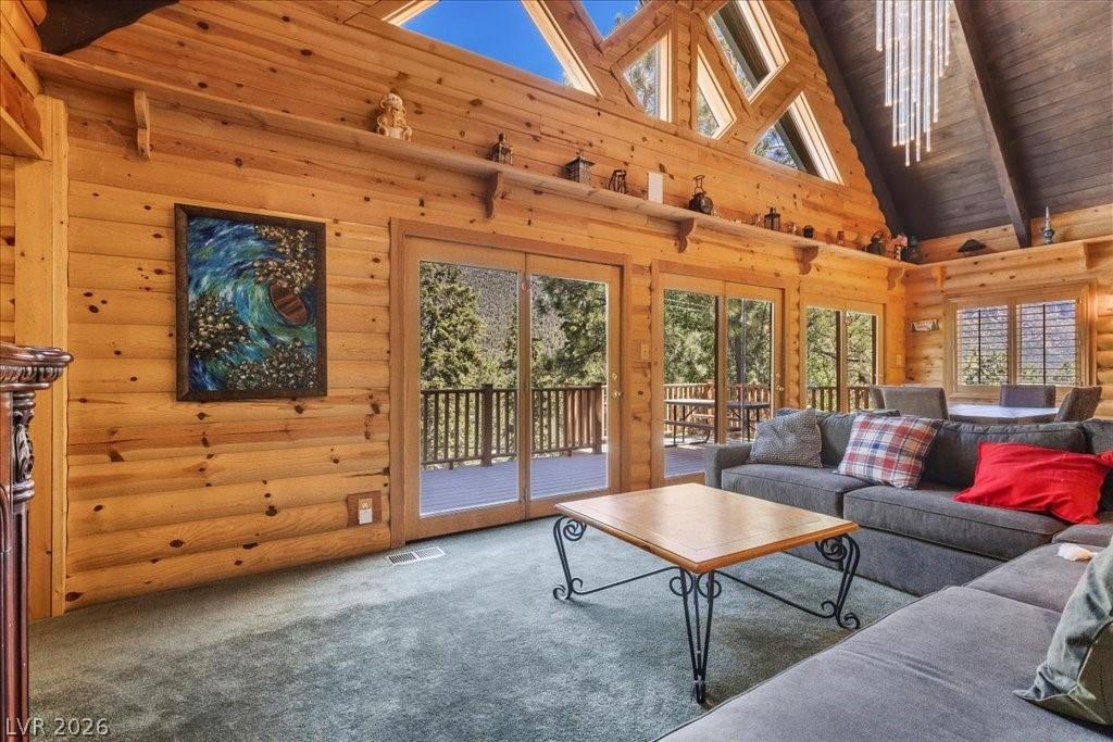Image 4: Wrapped in rich knotty pine log siding inside & ou