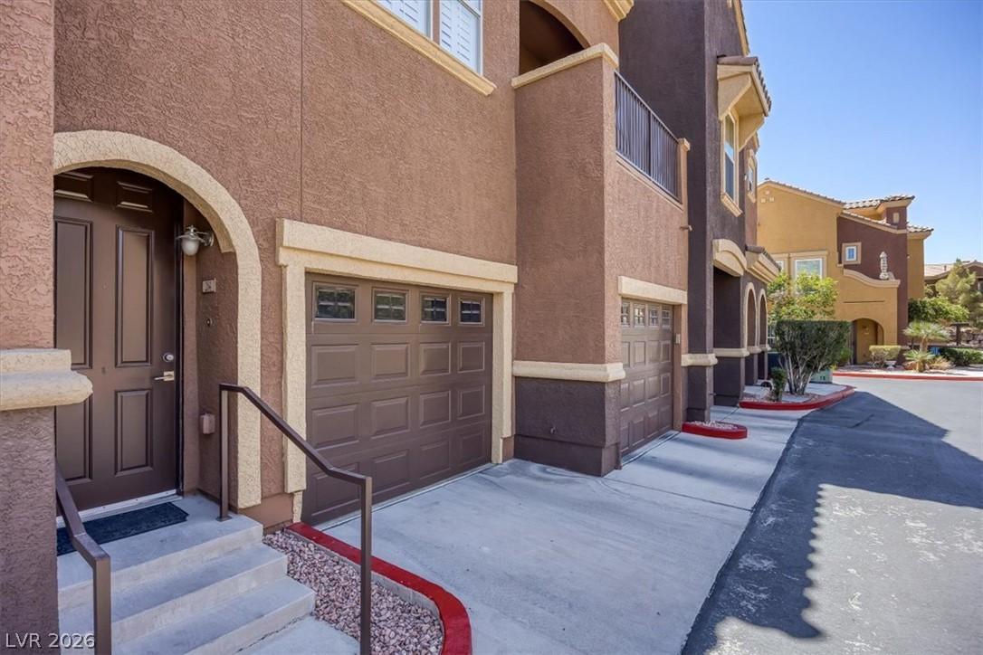 Image 4: A striking exterior featuring stucco construction,