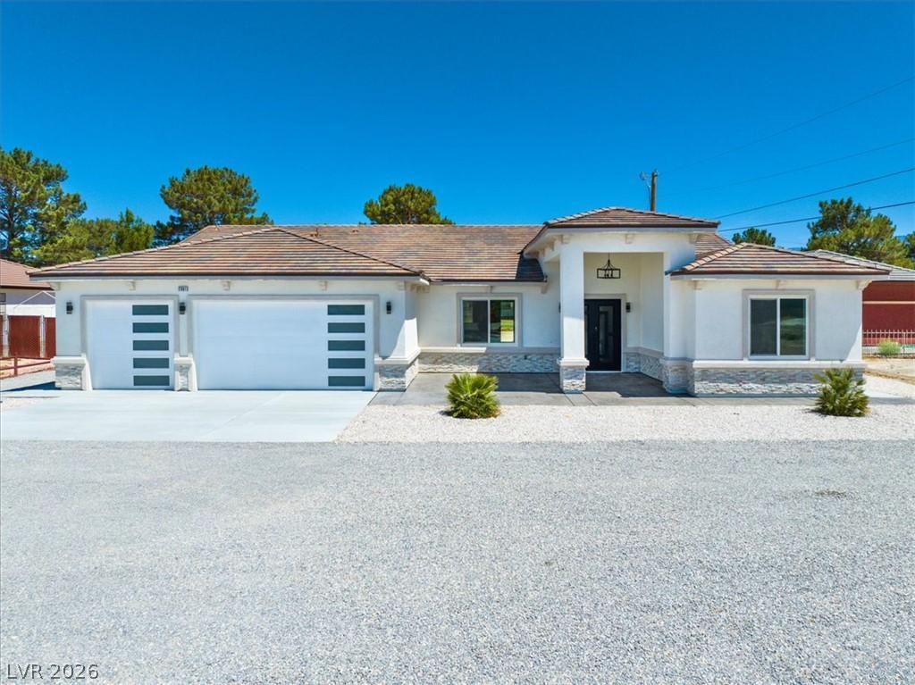 Image 2: Modern desert ranch with a two-car garage, welcomi