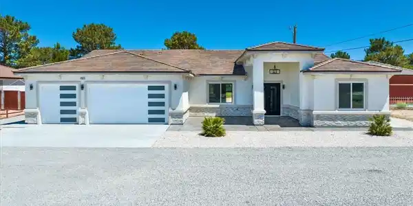 Image 2: Modern desert ranch with a two-car garage, welcomi