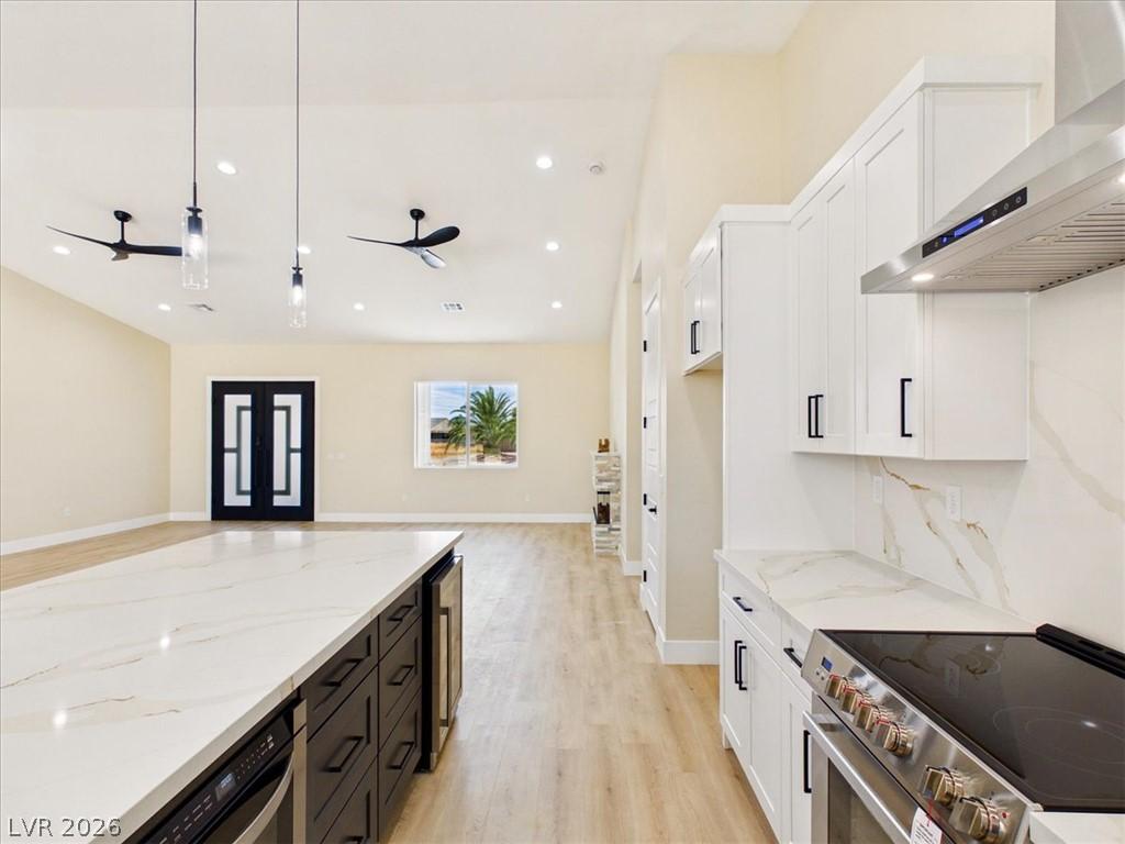 Image 4: A well-lit kitchen with a spacious island, contemp