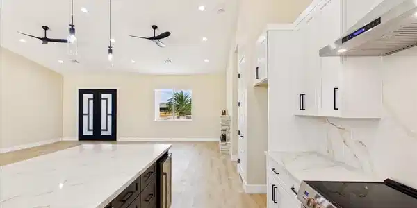 Image 4: A well-lit kitchen with a spacious island, contemp