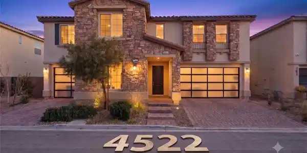Image 2: Exquisite stone accents and contemporary garage do