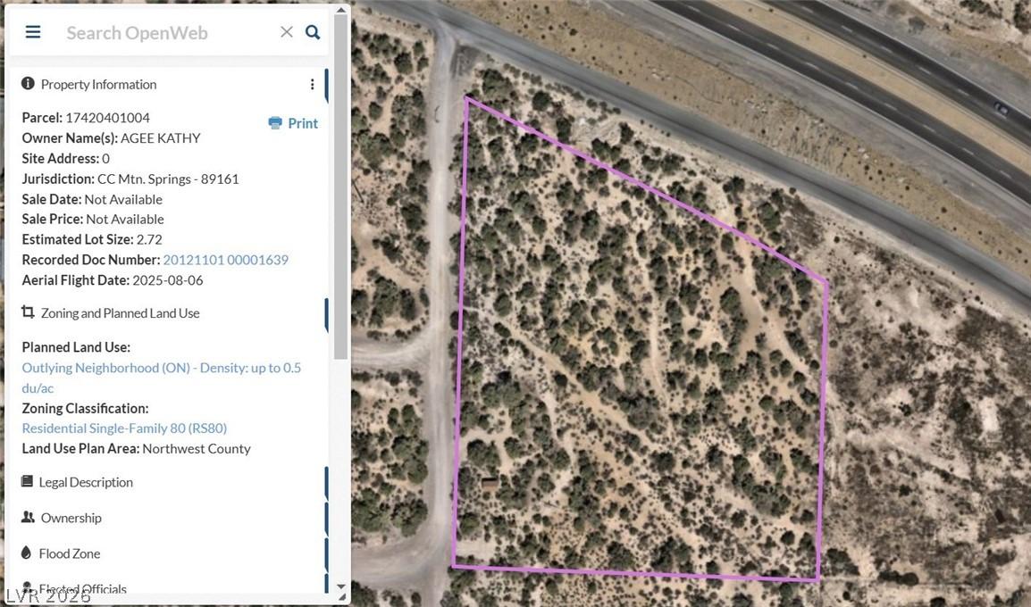 Image 3: This aerial view showcases a spacious lot with cle