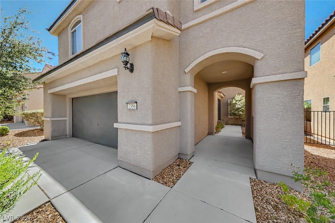 Image 2: This charming home offers an inviting exterior wit