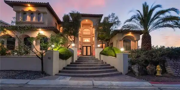 Image 3: Mediterranean / spanish home with stucco siding an