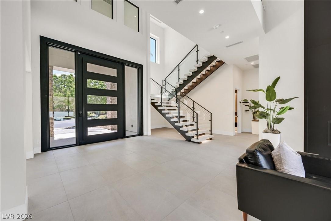 Image 2: A grand entrance welcomes with a striking modern s