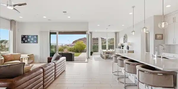 Image 2: Light-filled open-concept living with expansive sl