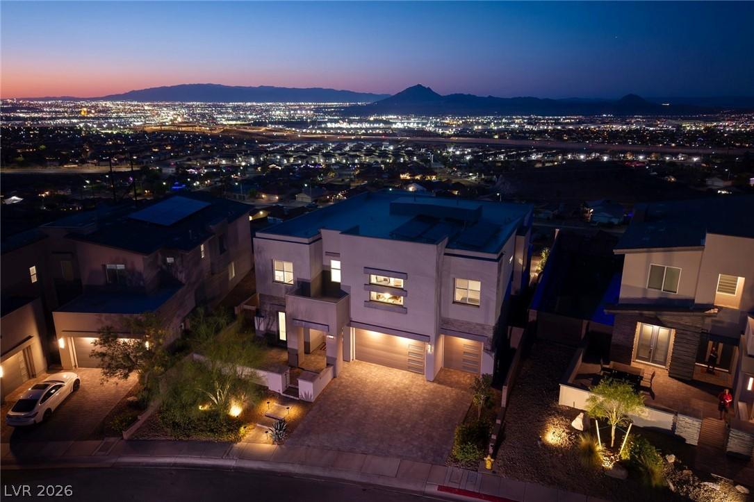 Image 2: An aerial perspective showcases a modern home with