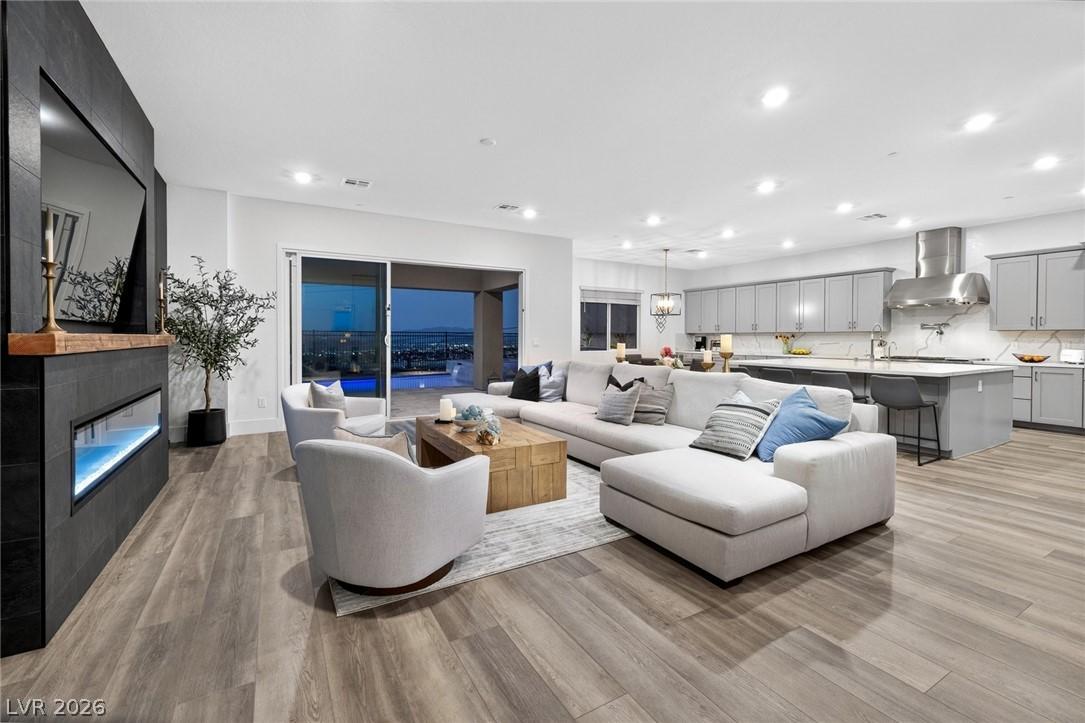 Image 3: This open-concept living space boasts an inviting