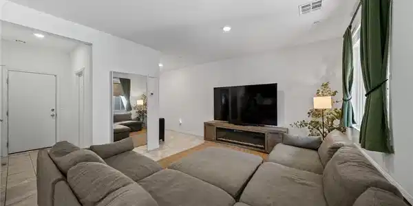 Image 3: A spacious living room designed for comfort and mo