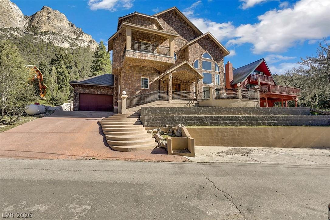 Image 2: This majestic mountain retreat features a stone fa