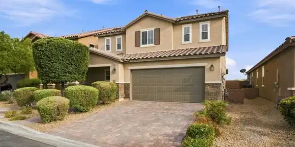 Image 3: An attractive paved driveway leads to the spacious