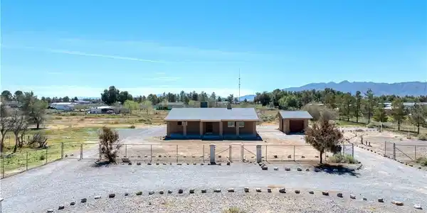 Image 2: View of front of home featuring a view of countrys