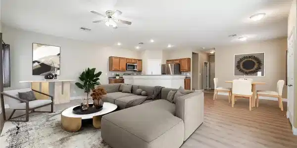 Image 2: An open floor plan seamlessly connects the living