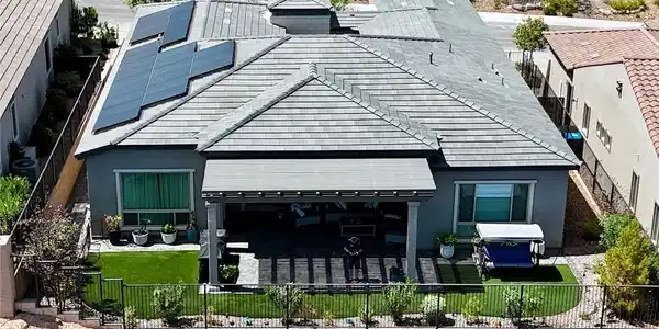 Image 4: Solar panels align along the modern tiled roof of
