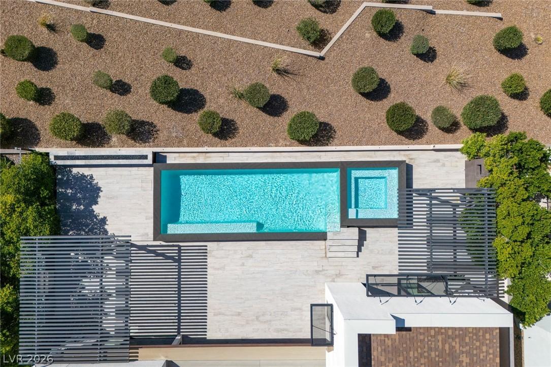 Image 2: An aerial perspective reveals a sparkling pool and