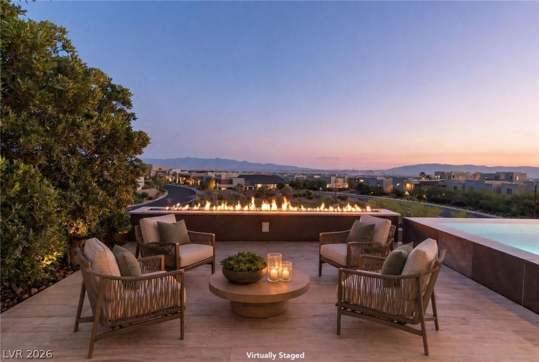 Image 4: A grand outdoor terrace with an extended linear fi