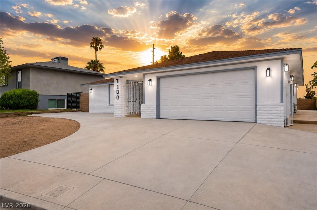 Image 2: A well-maintained facade features a spacious drive