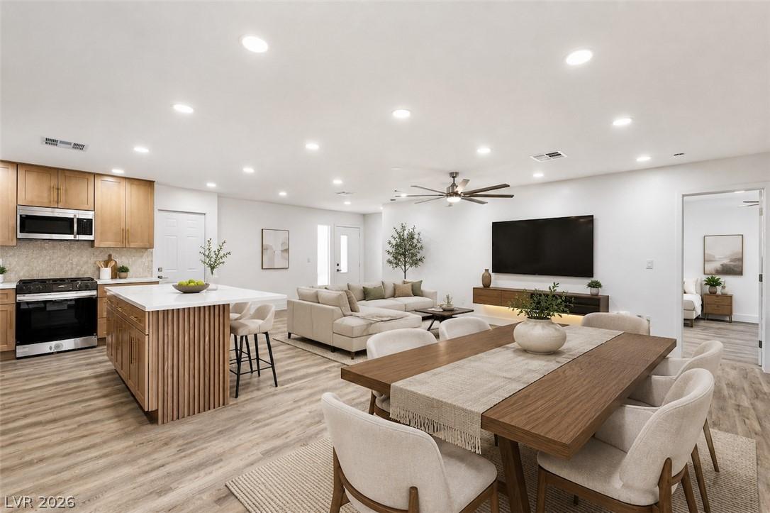 Image 4: An open-concept living space integrates a stylish