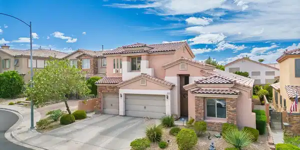 Image 2: Spanish tile roofing and stone accents define this