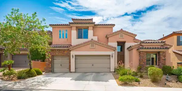 Image 3: Spanish tile roofing and stone accents define this