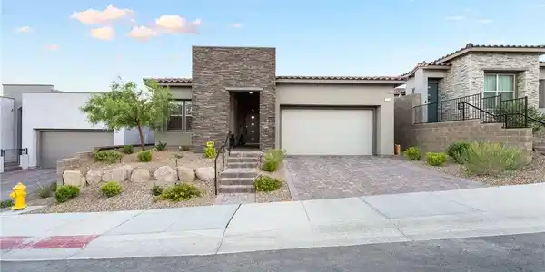 Image 4: A contemporary desert home presents a striking sto