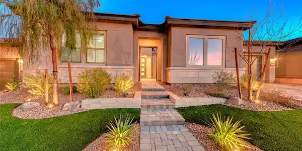 Image 2: Manicured pathways lead to a modern facade highlig
