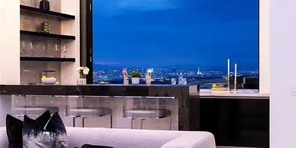 Image 4: Glittering city skyline views frame the sleek bar