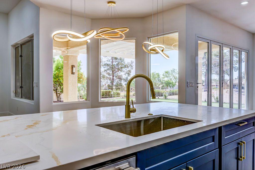 Image 2: A spacious, open kitchen with abundant natural lig