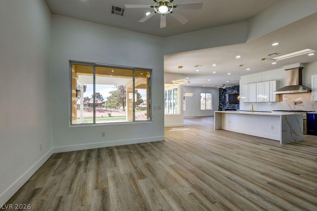 Image 4: Natural light floods this inviting living area, sh