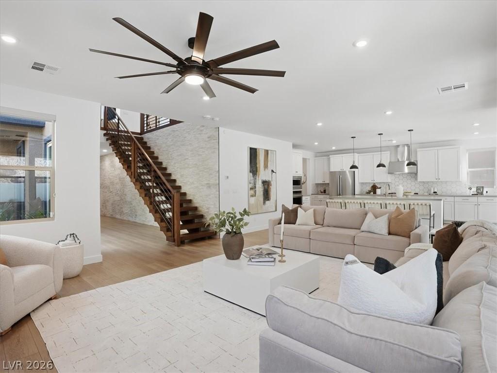 Image 1: This expansive open concept space features a brigh