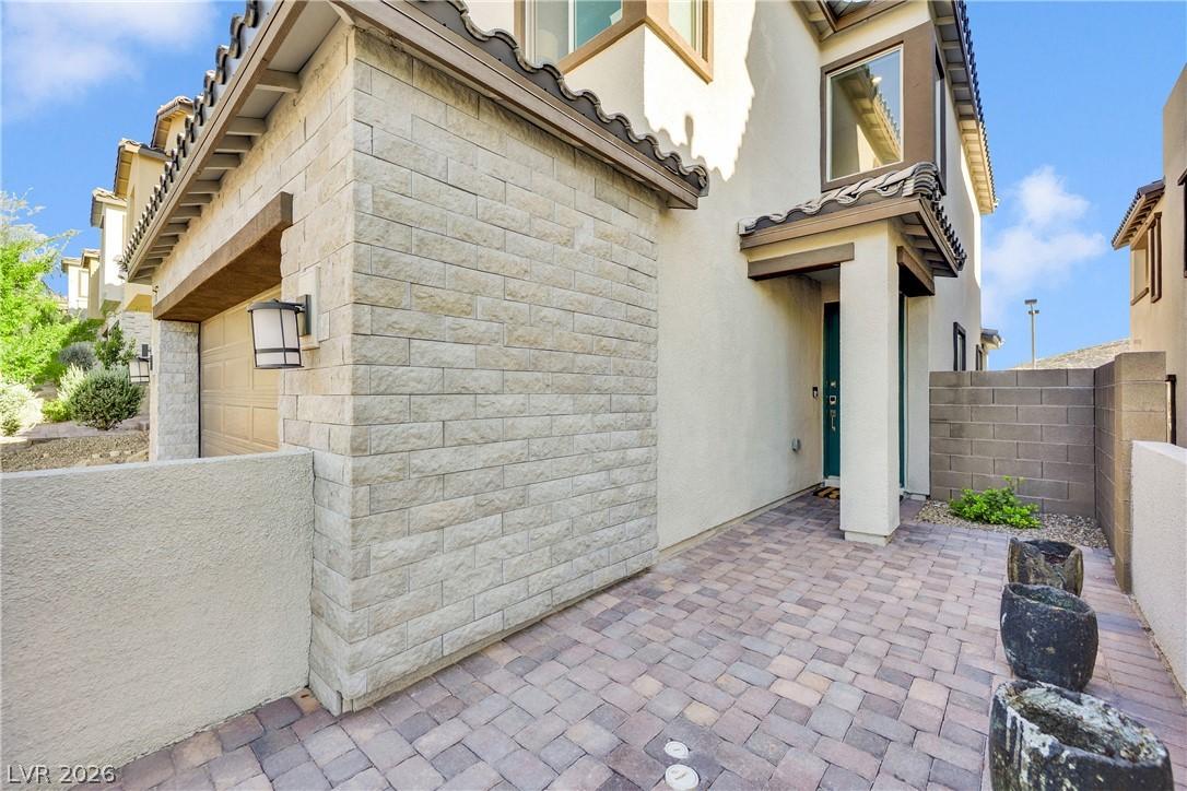 Image 3: A welcoming paver walkway leads to the entrance of