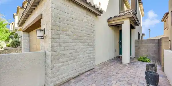 Image 3: A welcoming paver walkway leads to the entrance of