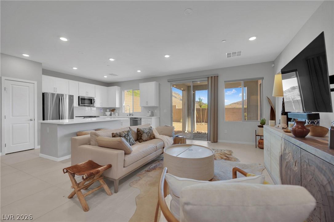 Image 4: A versatile open-concept living space seamlessly c