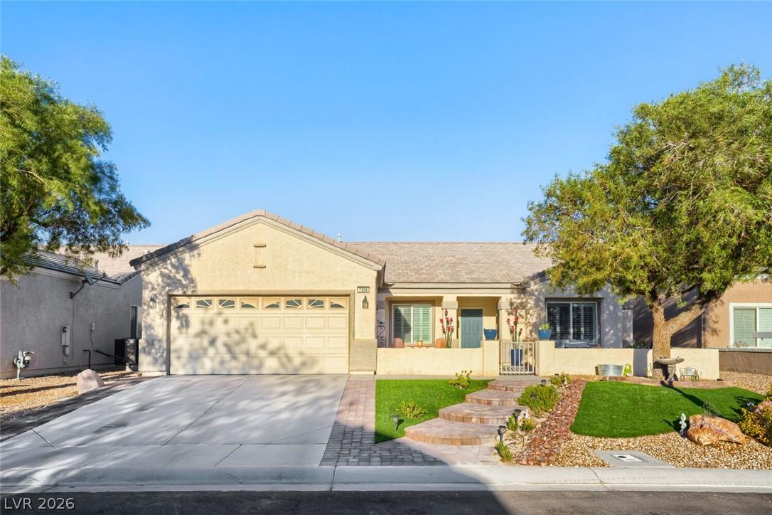 Image 1: A welcoming desert-adapted front yard features a w