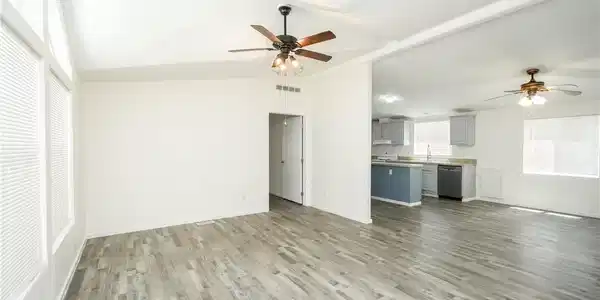 Image 3: A flowing layout connects the bright living space