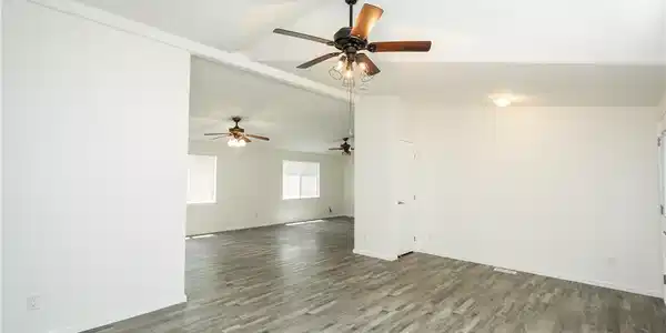 Image 4: An open floorplan with vaulted ceilings and cool-t