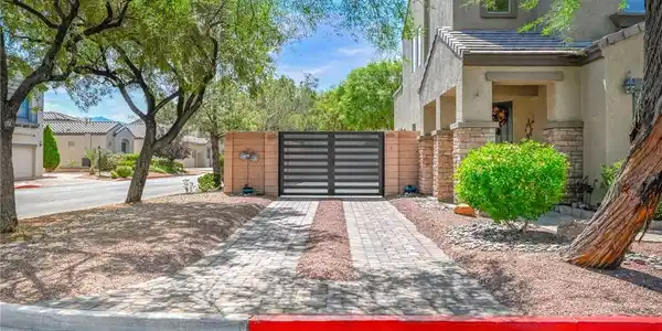 Image 2: A custom paver RV driveway leads to a secure new R