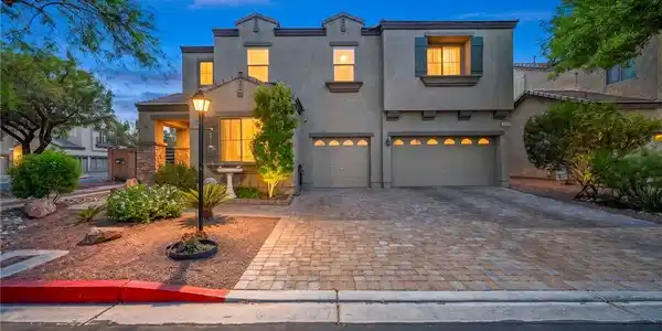 Image 4: Elegant desert landscaping frames a desirable pave