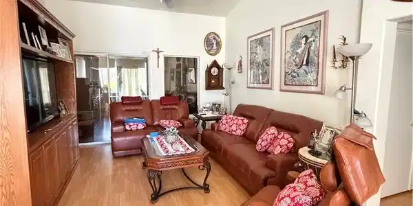 Image 2: Gleaming wood floors and vaulted ceilings elevate