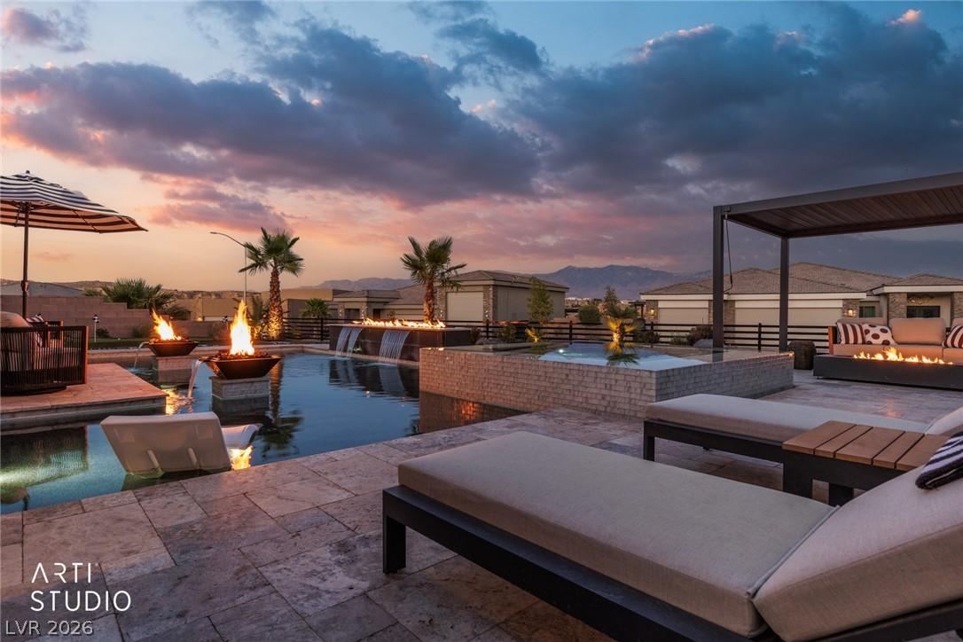 Image 4: An inviting outdoor oasis with a sparkling pool, f