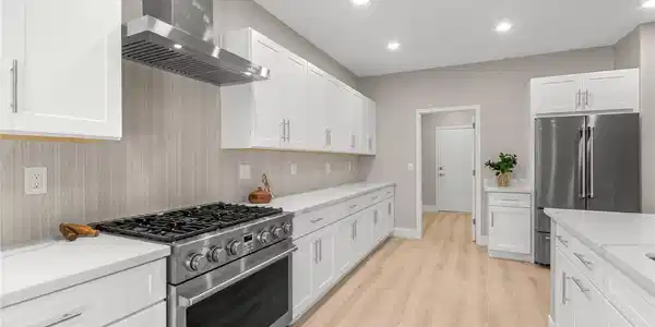 Image 3: Sleek stainless steel appliances and minimalist ca