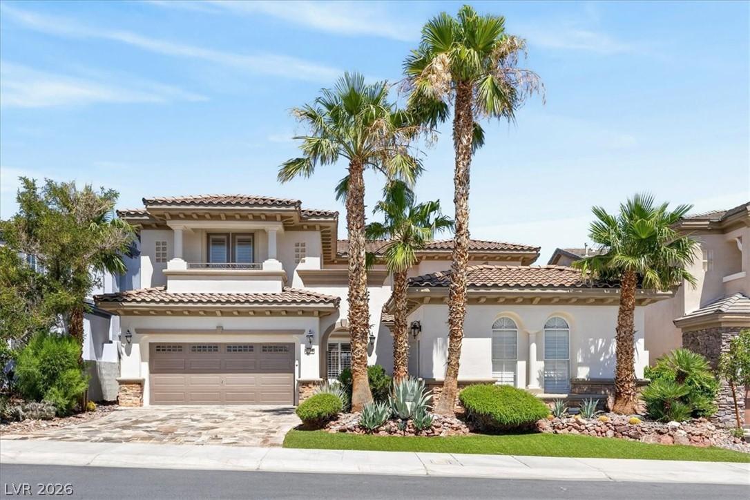 Image 2: A stately two-story residence with a Mediterranean
