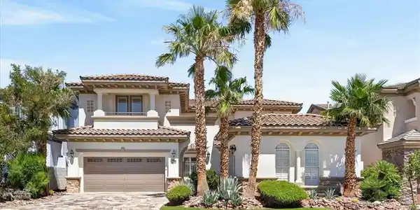 Image 2: A stately two-story residence with a Mediterranean