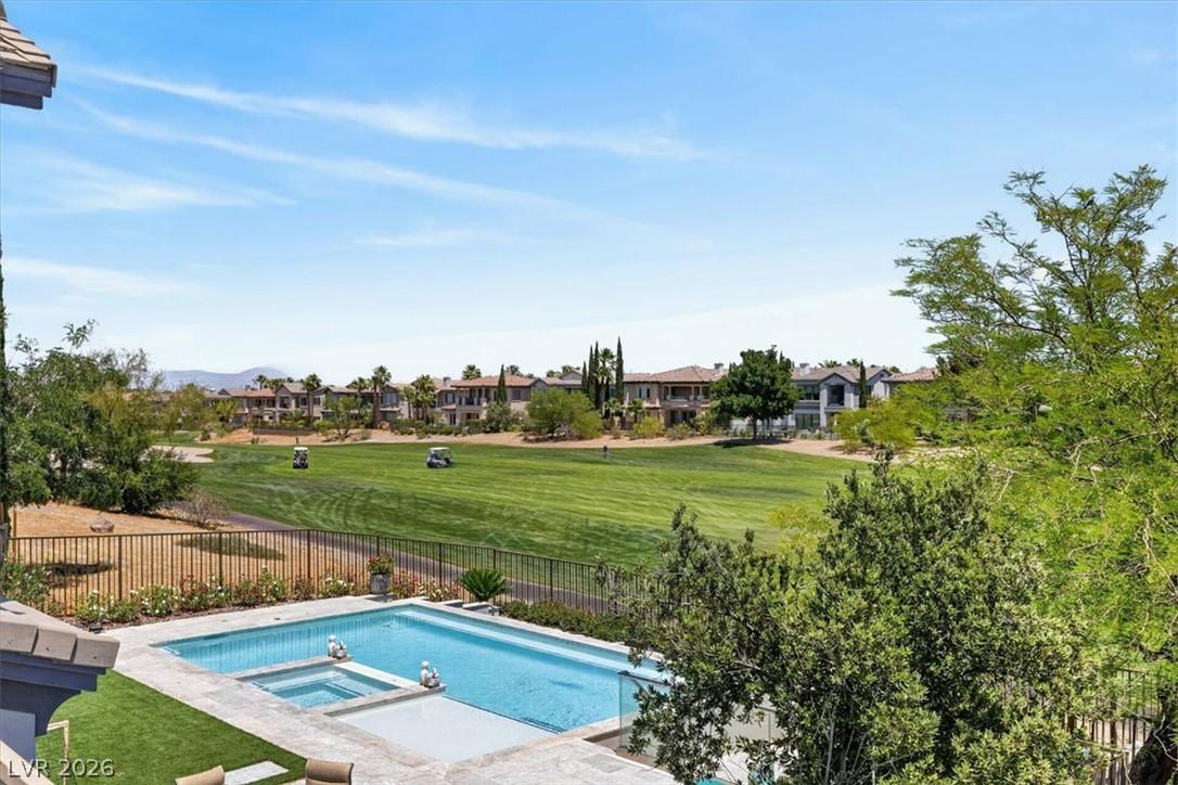 Image 4: Golf course vistas accompany this alluring pool an