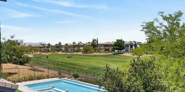 Image 4: Golf course vistas accompany this alluring pool an
