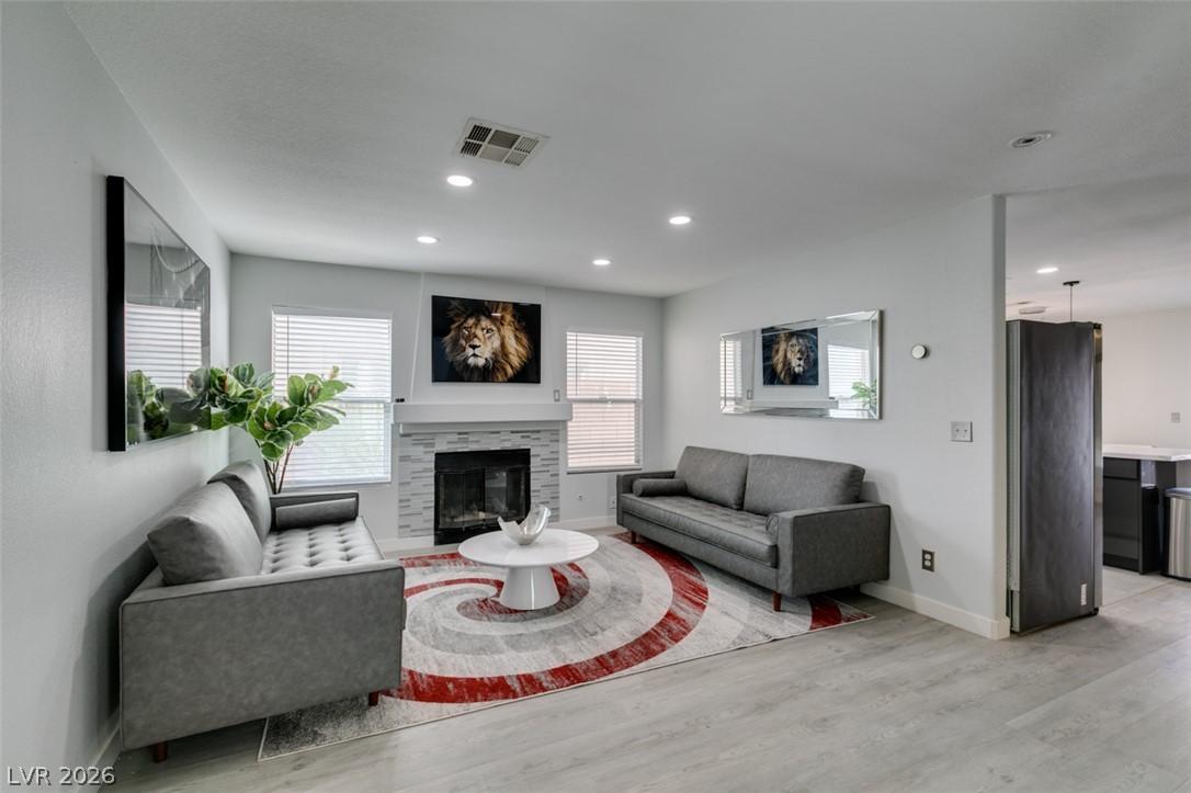 Image 4: A refined living space features a tiled fireplace,