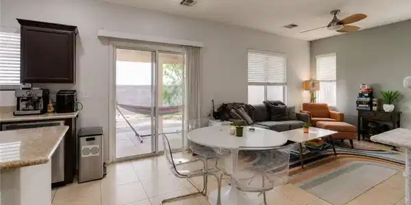 Image 4: An open floor plan seamlessly connects the kitchen