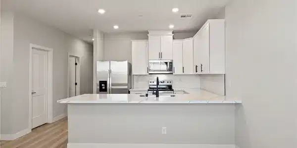 Image 3: Bright and open, this contemporary kitchen feature
